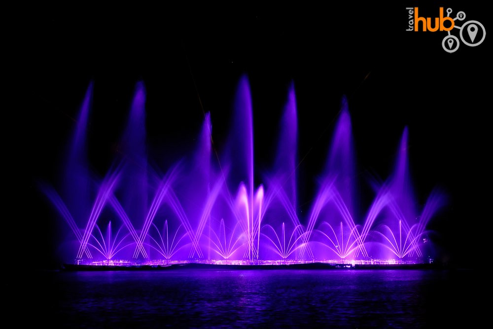 Enjoy the  fountain and laser show on the central lake