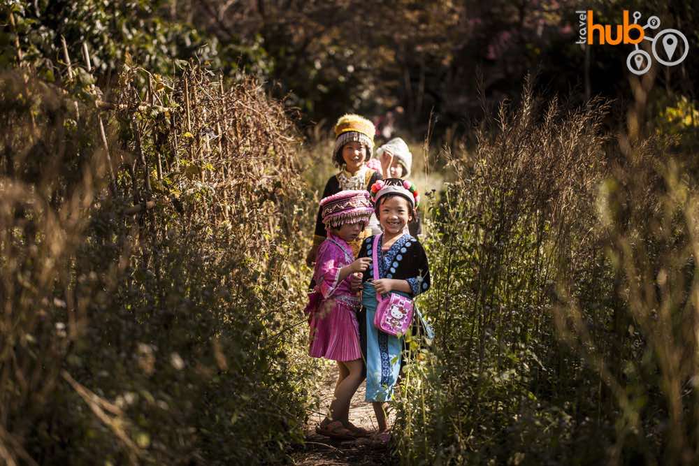 Young Hmong girls playing near the village