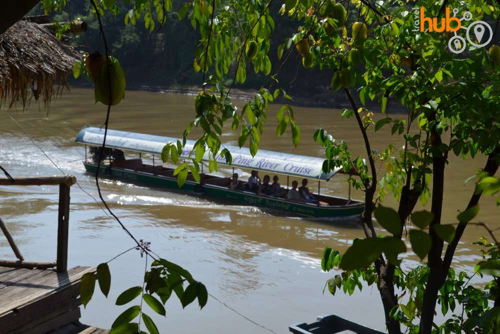 Mae Ping River cruise boat as seen from the farmers house